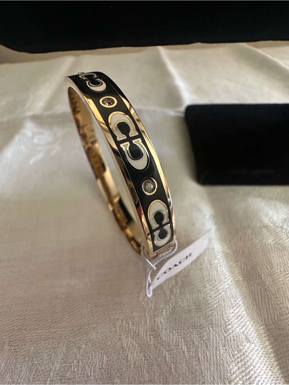 Coach Gold-Tone Bangle with Black Enamel and Crystal Logo Accents